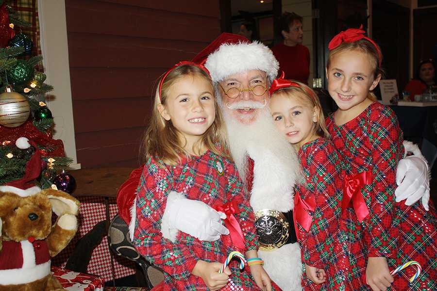 Le Hook's long white beard makes him instantly recognizable when he walks into the high school for a substitute teaching job. But hundreds of kids across the Outer Banks know him as Santa Claus rather than Mr. Hook. SUBMITTED PHOTOS
