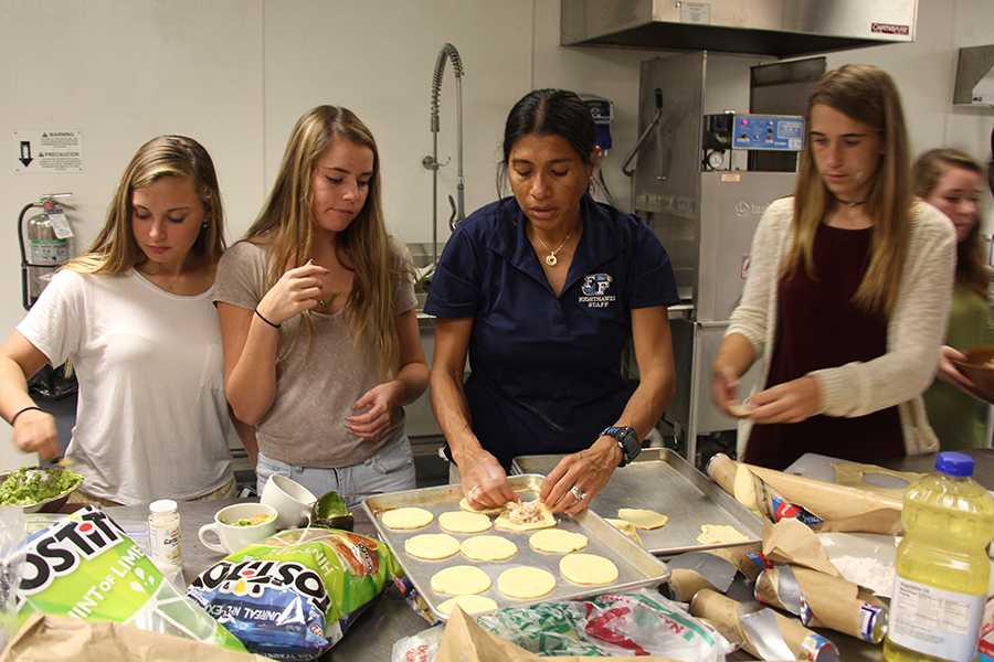 Signing up for a club can help students learn outside of the classroom. Last year, members of the Spanish Club worked with Nitzia Gale to make special treats one day after school in the culinary arts room. PHOTO BY BEN TRAN/NIGHTHAWK NEWS