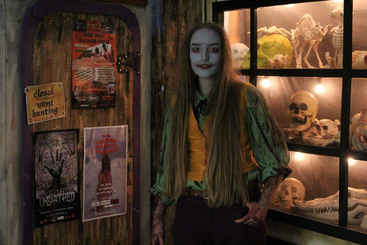 Junior Charlotte Tyson shows off her Joker costume and makeup -- one of her many festive getups during the Halloween season. PHOTO BY MICHAELA KELLY/NIGHTHAWK NEWS
