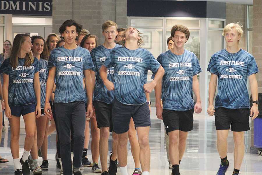 Sophomore Zach Hughes screams with excitement as the cross country teams make their way from the cafeteria to the bus lot for a school-wide sendoff. FFHS competes in the NCHSAA 2A Championships on Saturday in Kernersville. PHOTO BY BUZZY STATEN/Nighthawk News Magazine