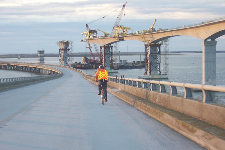 Sean Stultz pedals his way across the Bonner Bridge on a long-distance bike trip. The freshman has a goal to ride his bike from Corolla to Hatteras. SUBMITTED PHOTOS