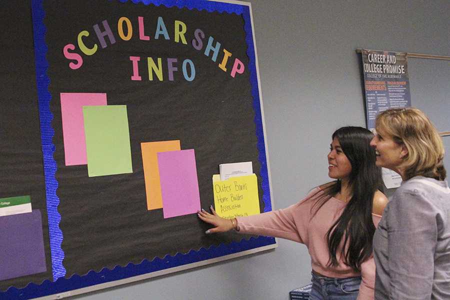 Students such as senior Genesis Mejia-Jimenez have been spending plenty of time in the counseling center with Lisa Wheless figuring out what scholarships they can apply for to make college a little cheaper. PHOTO BY PAYTON GADDY/Shorelines Yearbook