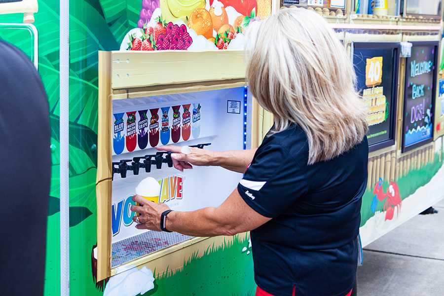 A Dare County Schools employee visits the Kona Ice food truck after the annual convocation in the FFHS auditorium last month. Food trucks from all over the OBX will be on display for the second Food Truck Showdown on Sunday in Nags Head. PHOTO BY NATHAN LAWRENSON/Special to Dare County Schools