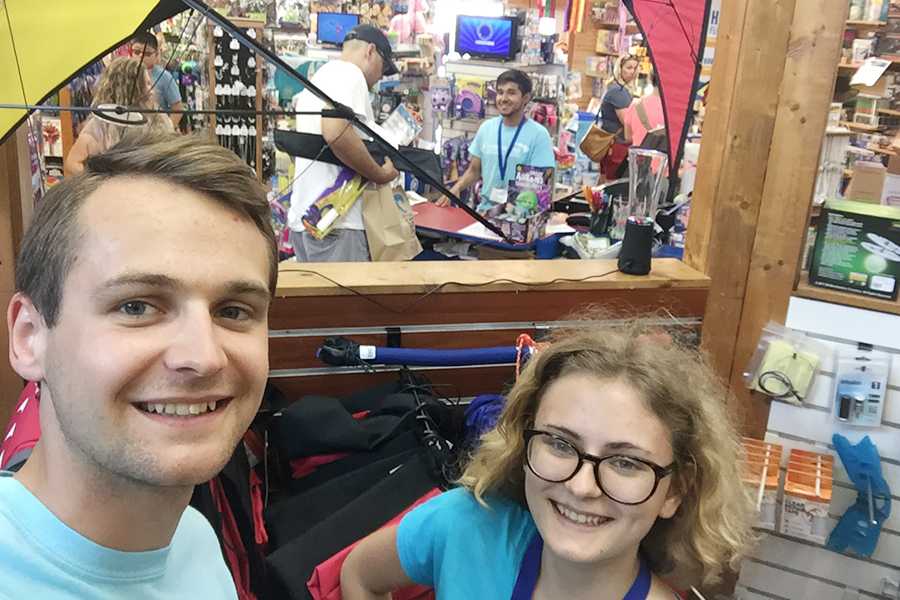 Senior Ivy Doyle shares a fun moment with Jacek Polak from Poland during his summer working at Kitty Hawk Kites. Submitted Photo