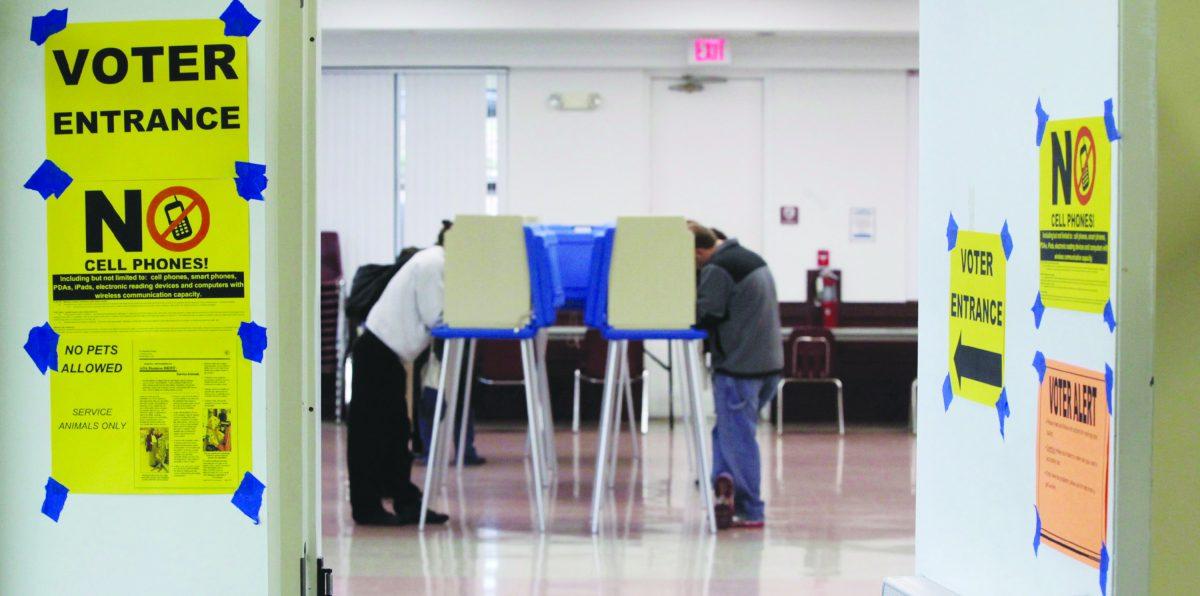 Reminders about polling place rules and etiquette greet voters at the entrance to vote at the Herbert Young Community Center polling place in Cary. Turnout increases and decreases with seemingly every election, especially when it comes to younger voters.
Photo by  Shawn Rocco/Raleigh News & Observer/TNS