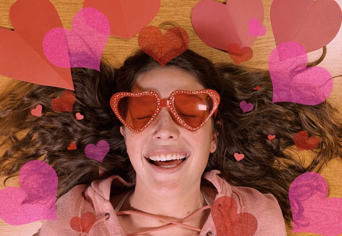 Staffer Simone Midgett poses with paper hearts to show her love of Valentine's Day. PHOTO BY Buzzy Staten/Nighthawk News