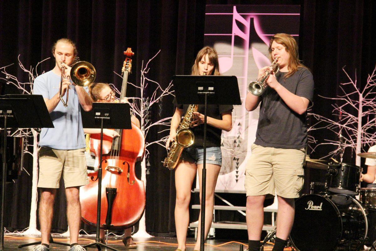 Photo by Buzzy Staten/Nighthawk News
Senior Parker Duck performs an original song with an ensemble that includes classmate Izzie Estes during a recent Empower Time. Duck wrote the song as part of his senior project.