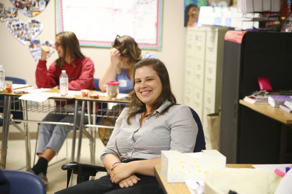 Sophie Shaw sits in on senior project presentations during here final weeks working with students. The college counselor plans on heading to grad school and perhaps writing a book following her two-year stay on the Outer Banks.