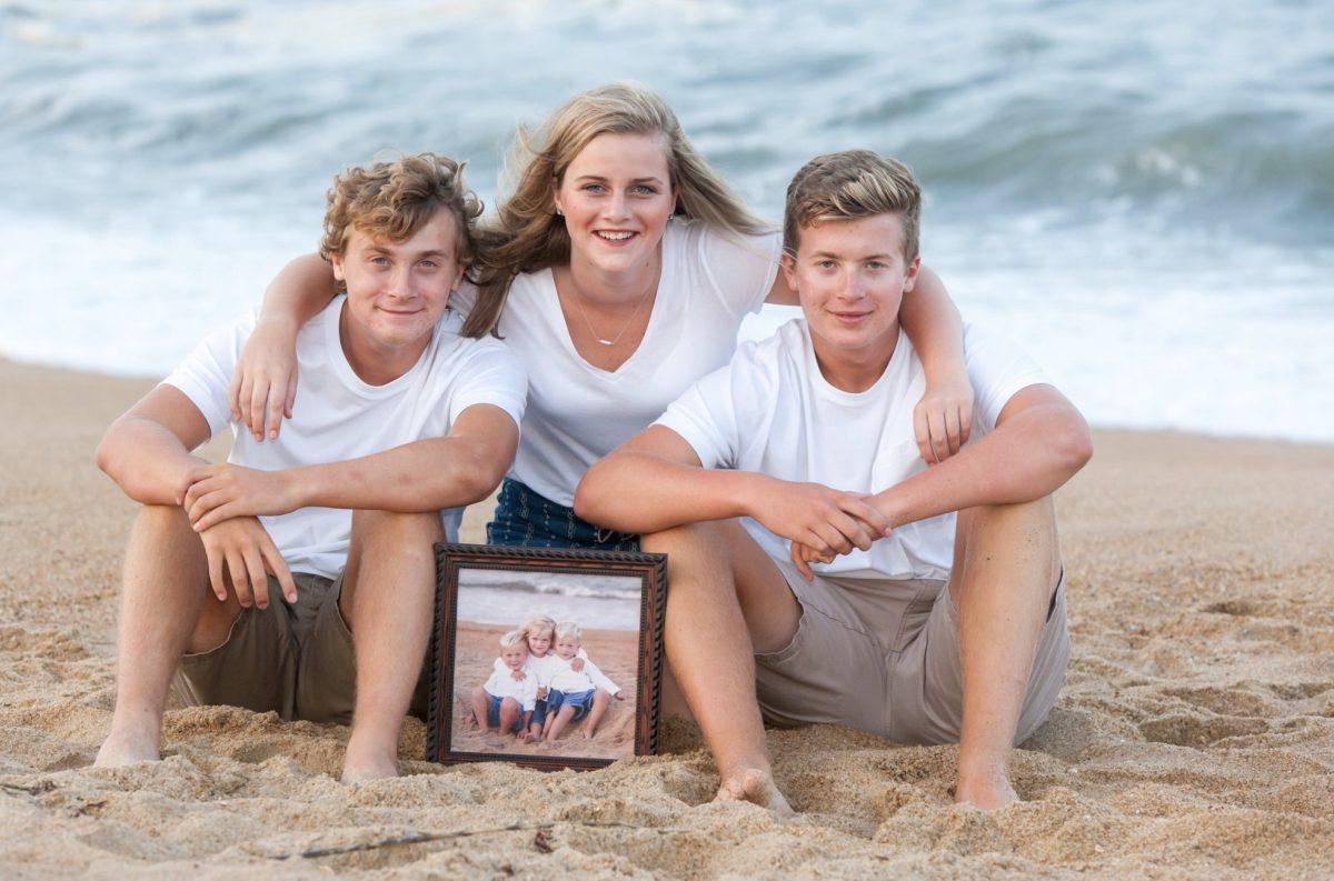 Seniors Mason, Sophie and Austin Johnson take a senior photo on the beach. The triplets' bond is one that will never be broken, even as they go to different colleges next year. Austin will attend N.C. State, Mason the College of the Albemarle, and Sophie heads to UNC Charlotte. 