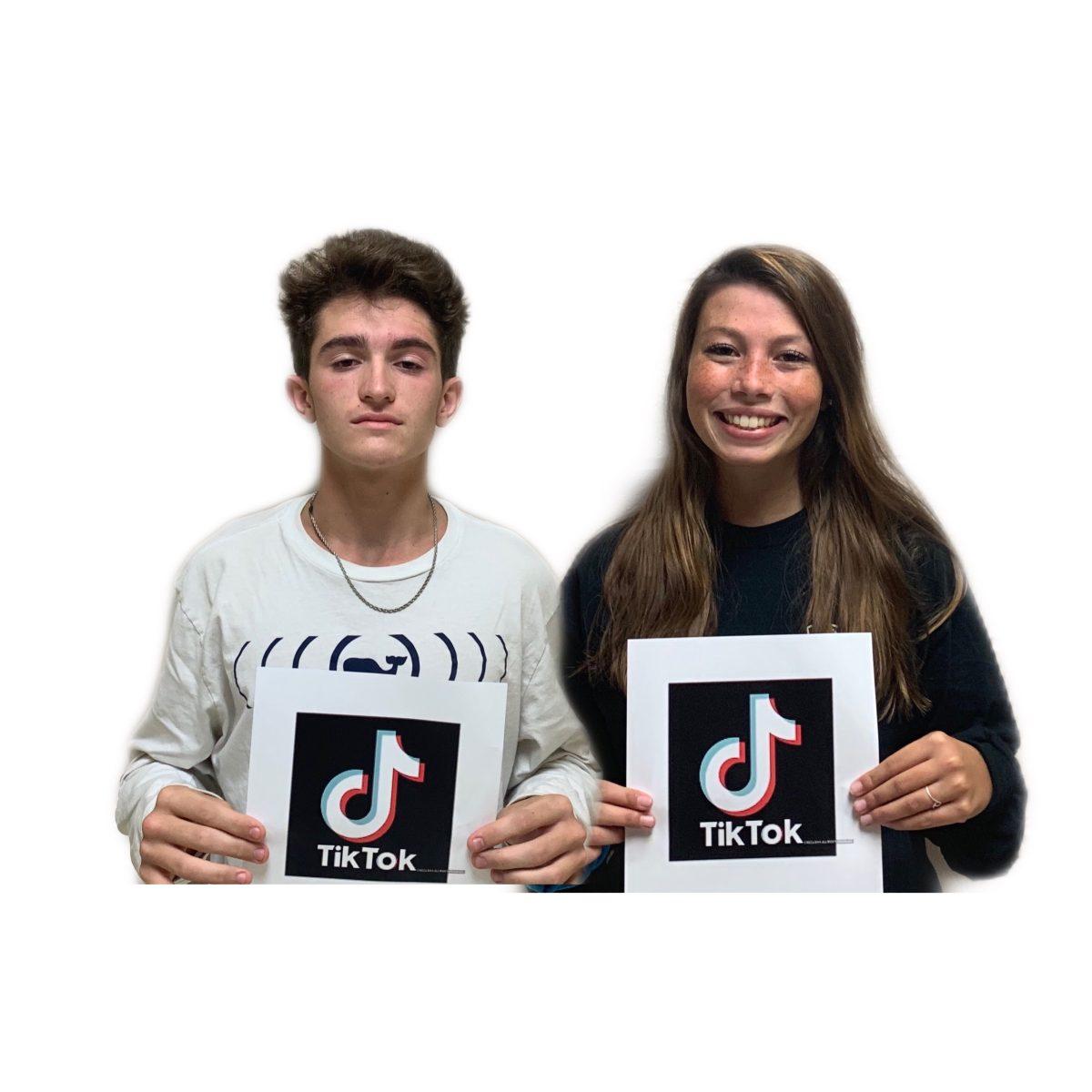 Juniors Brad King and Maggie Beacham display the TikTok logo, an app that they have gained a large following on.
