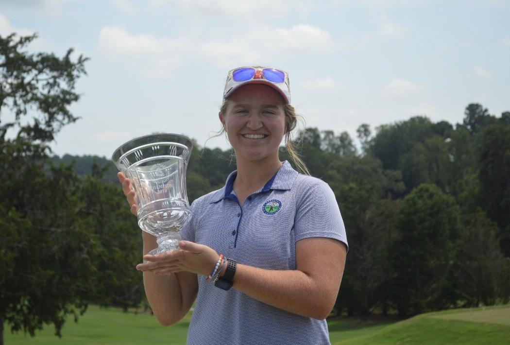 Junior Katherine Schuster poses with her award from Hope Valley Junior Golf Invitational in Durham, North Carolina.