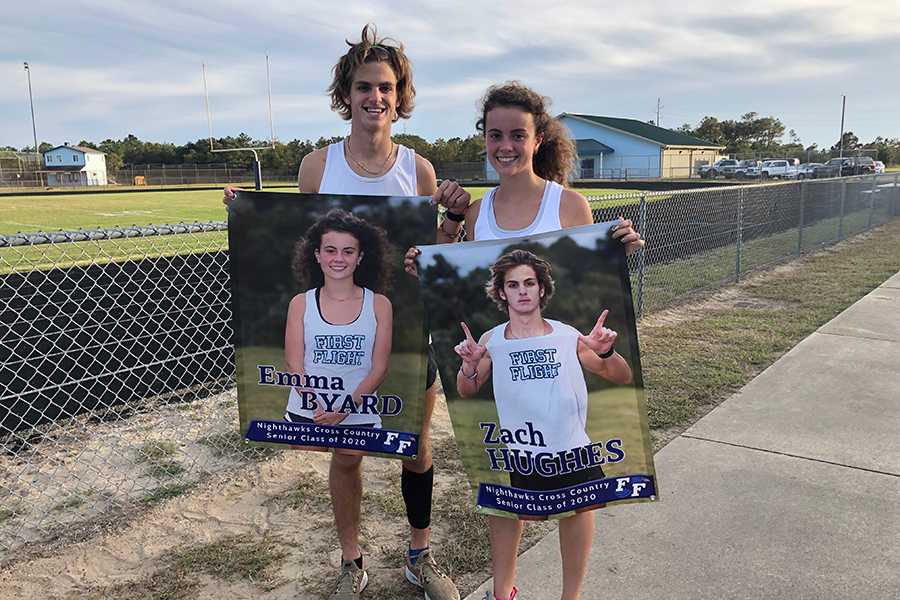 Seniors Zach Hughes and Emma Byard show off their banners during the cross country Senior Night festivities earlier this month. After getting to know each other on a team bus ride, the duo has become First Flight's running power couple. PHOTOS SUBMITTED BY EMMA BYARD