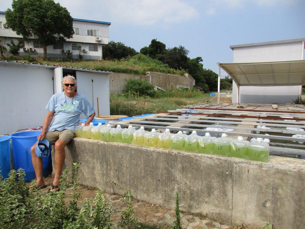 In Lake Taihu, China, Professor Hans Paerl sits with 15 water samples that he collected from the lake to study cyanobacterias phytoplankton blooms. PHOTO SUBMITTED BY HANS PAERL