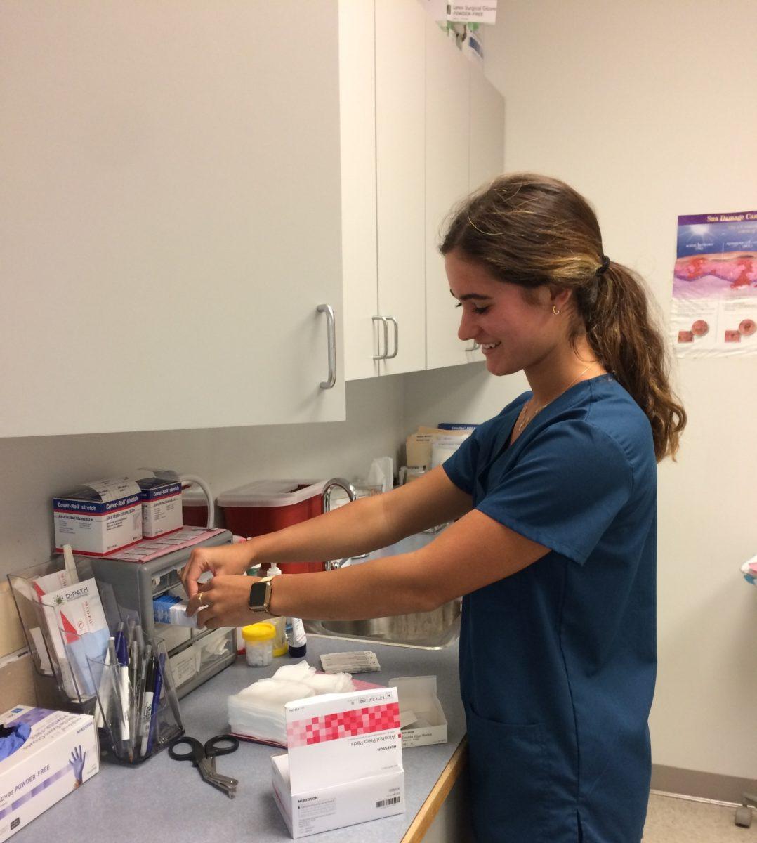 enior Zoë Blankenship prepares supplies for the exam rooms at Tidewater Skin Care. This is Blankenship's first year as an intern. PHOTO BY KATHY NEAL/Special to Nighthawk News
