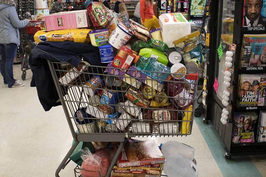 Carts are filled as Brooklyn residents prepare for the coronavirus at the Brooklyn Country Market grocery store on Friday, March 13. Photo by Mikayla Carter/MLive.com/TNS
