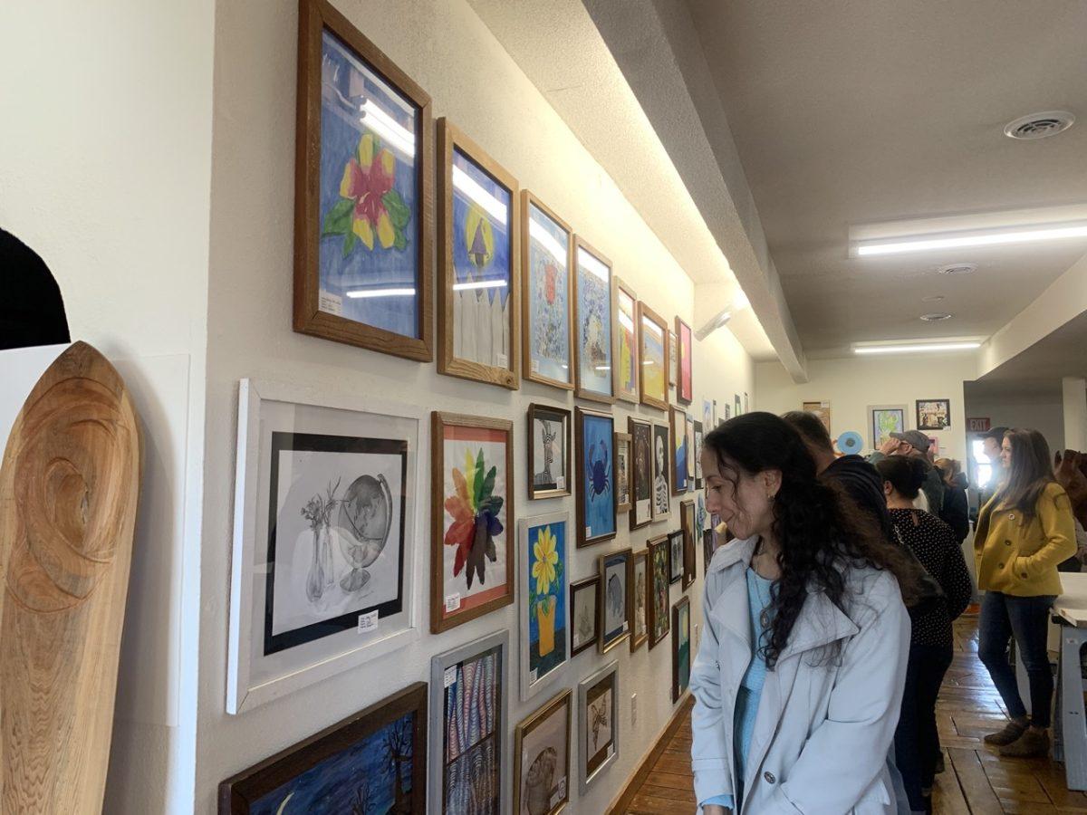 Students and parents walk around the Glenn Eure Ghost Fleet Gallery for the Dare County Schools Art Show. The art show has been held at the gallery for over thirty years. PHOTO BY EMMY BENTON/Nighthawk News
