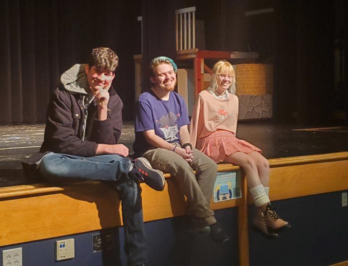 Three StageKraft seniors pose at the end of the stage while rehearsing for the spring musical Mamma Mia.